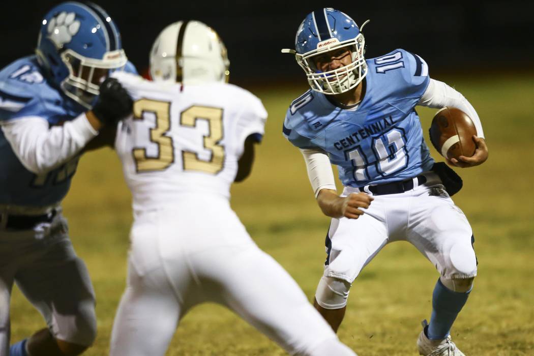 Centennial quarterback Colton Tenney (10) runs the ball against Faith Lutheran during the secon ...