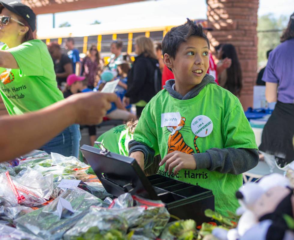 George E. Harris Elementary student Guiseppe Castro, 10, collects donations for their garden cl ...