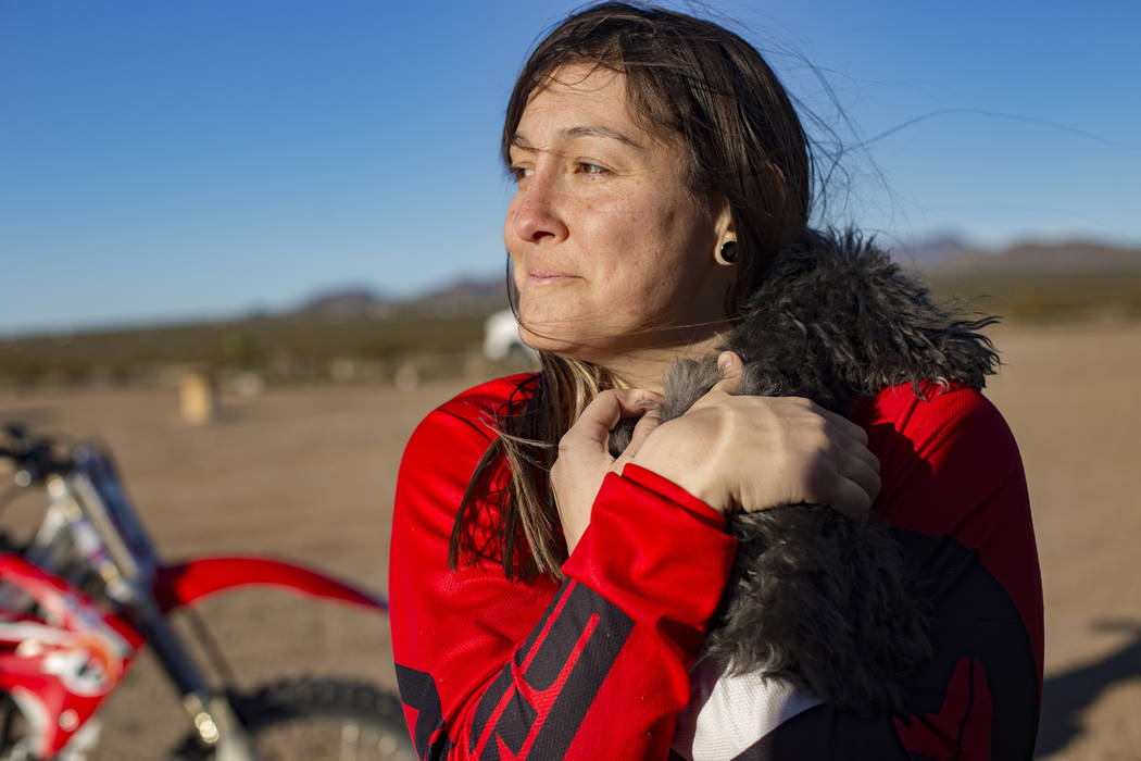 Angie Wright holds her dog Phoenix at Western Raceway track outside White Hills, Arizona, Sunda ...