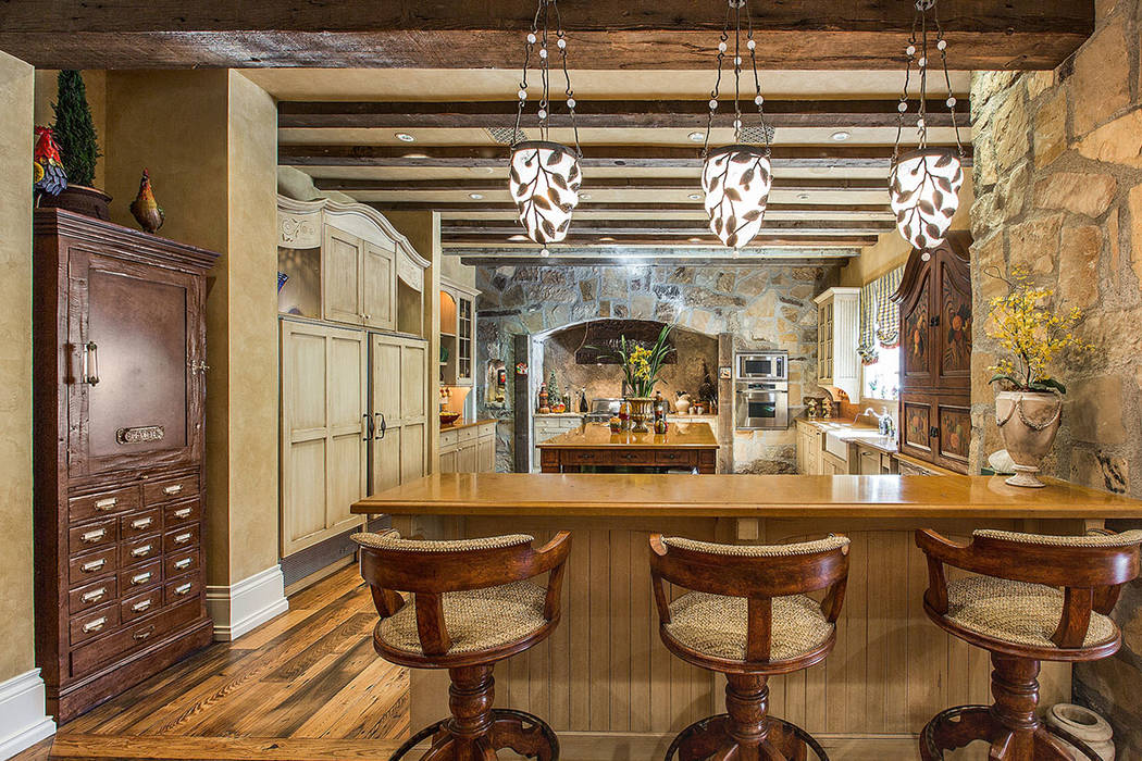 The kitchen has a French country style. (Fraser Almeida /Luxury Home Photography)
