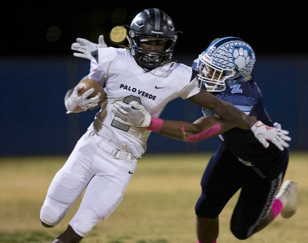 Palo Verde junior Charron Thomas (2) runs a kick back down the sideline past Centennial senior ...