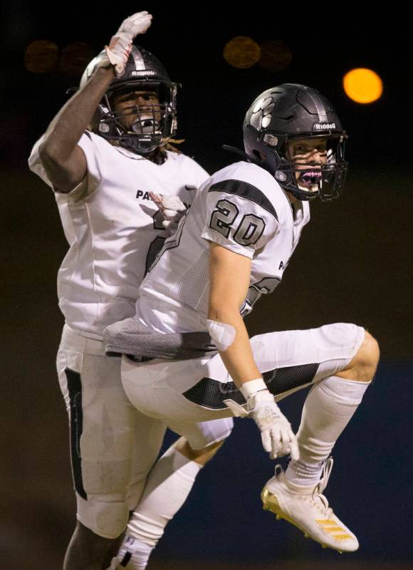 Palo Verde sophomore Luca Mauriello (20) celebrates with teammate Charron Thomas (2) after Maur ...