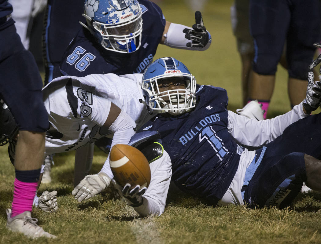 Centennial senior Jordan Smith (1) looks at the referee after Smith was called short of the goa ...