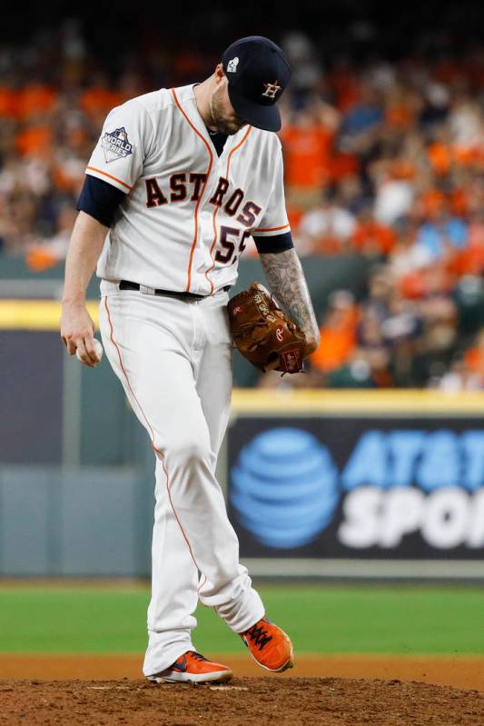 Houston Astros relief pitcher Ryan Pressly kicks the mound after giving up a two-RBI single to ...