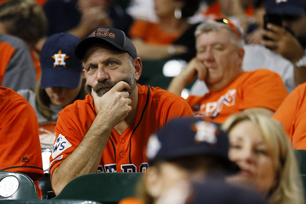 Fans watch during the eighth inning of Game 2 of the baseball World Series between the Houston ...