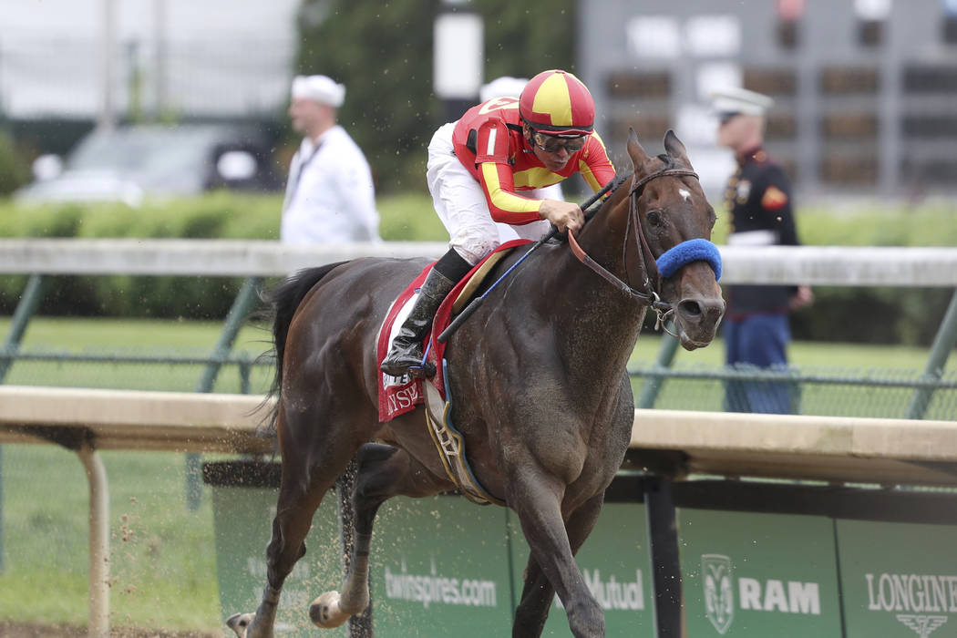 FILE - In this May 3, 2019, file photo, McKinzie, ridden by jockey Mike Smith, wins the Grade 2 ...