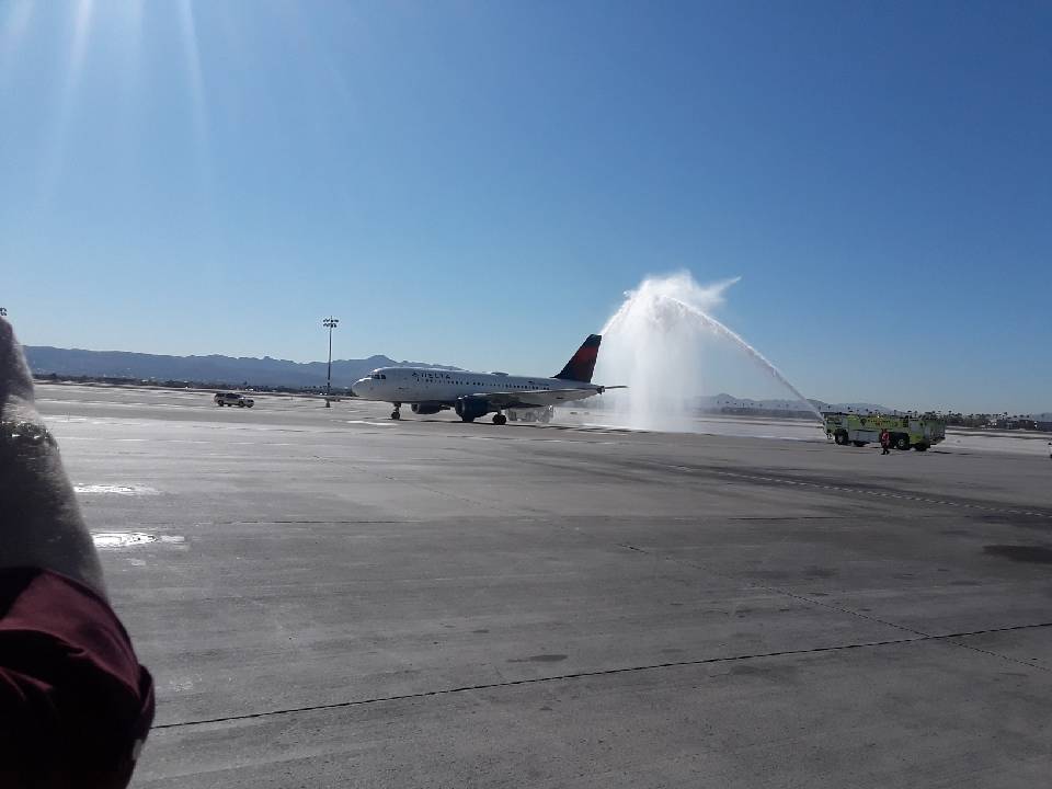 A water cannon salute greets the plane carrying the remains of Seaman 2nd Class Moyses Alfonso ...