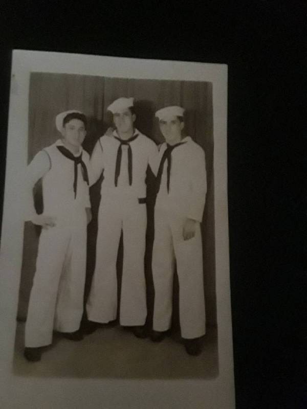 Seaman 2nd Class Moyses Alfonso Martinez, right, and his crewmen during World War II. Martinez' ...