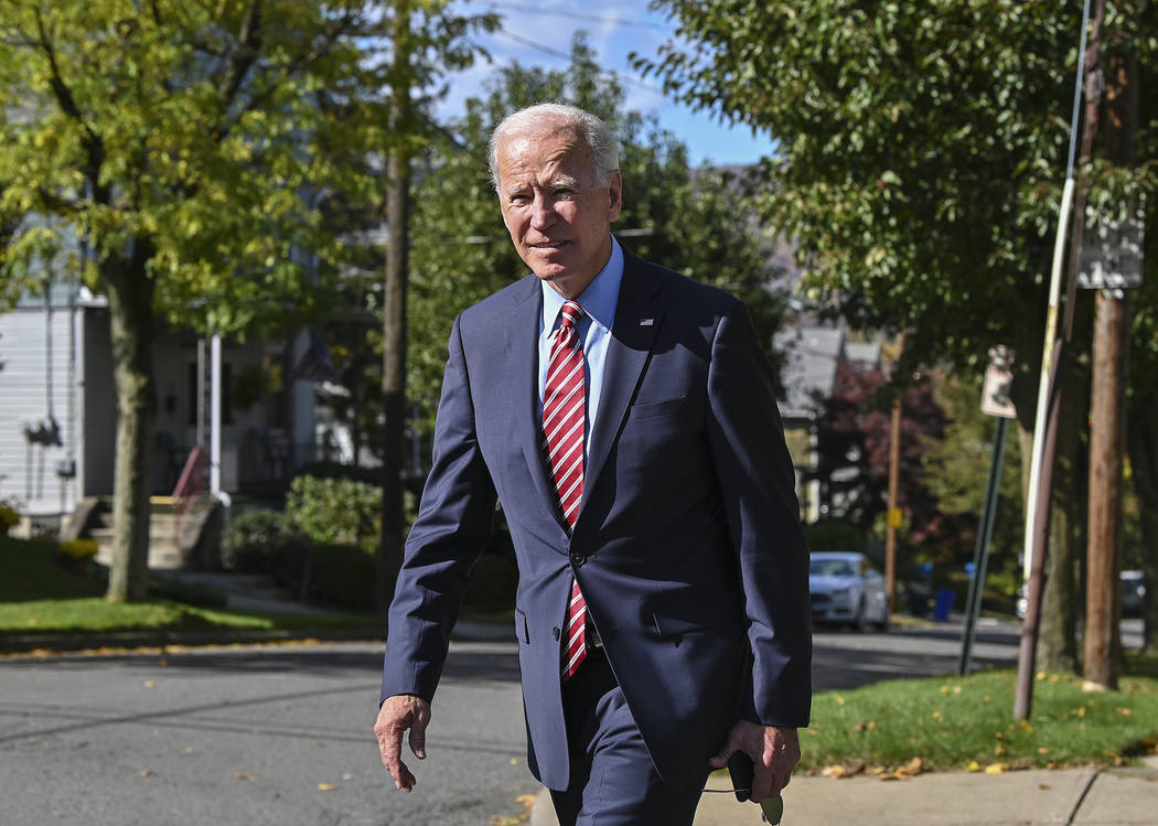 Former U.S. Vice President Joe Biden walks the streets of his childhood home in Scranton Pa., a ...