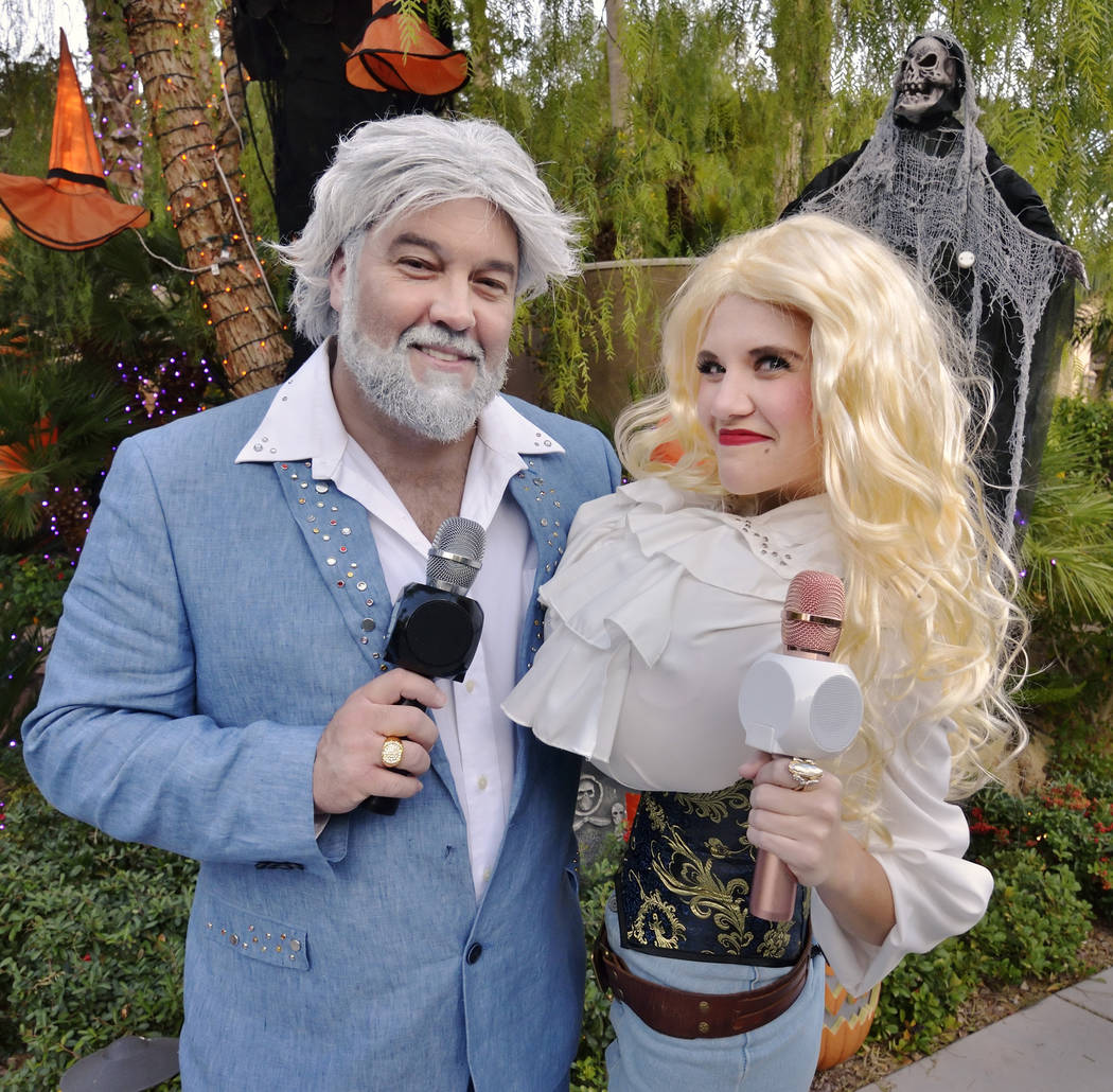 David Tolliver, as Kenny Rogers, and Jenna Pate, as Dolly Parton, are shown on Halloween night ...