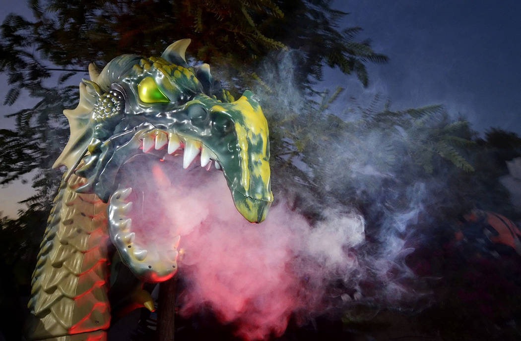 A fire-breathing dragon is part of Carmine Vento's Halloween display. (Bill Hughes Real Estate ...