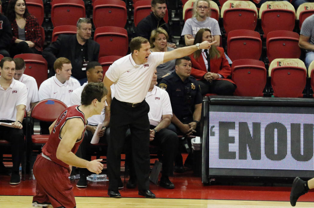 UNLV's basketball head coach T.J. Otzelberger directs his players during the second half of the ...