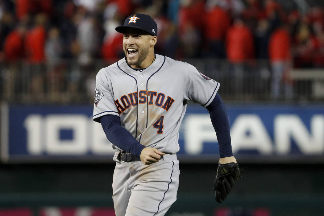 Houston Astros right fielder George Springer celebrates their teams win against the Washington ...