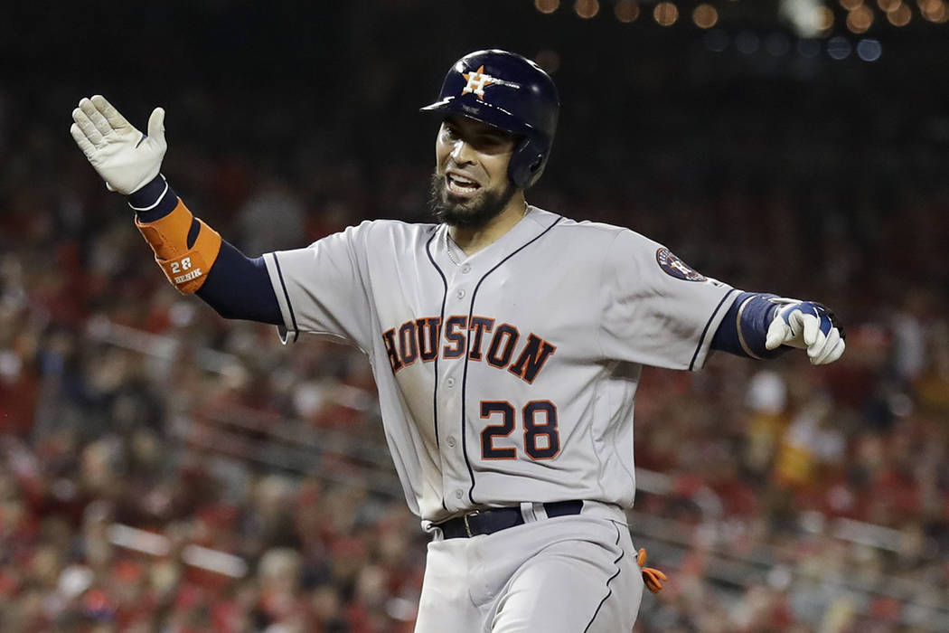 Houston Astros' Robinson Chirinos celebrates after his home run against the Washington National ...