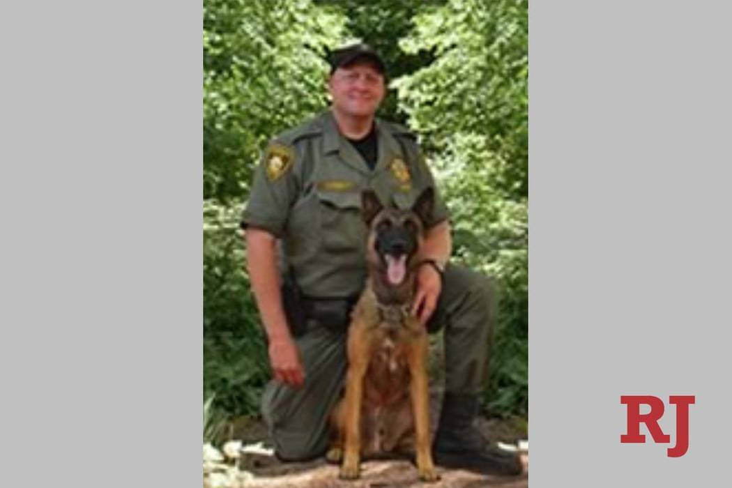 Metro patrol dog Hunter, seen with his handler Jeff Corbett, was stabbed in the neck by a suspe ...