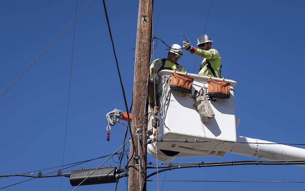 SoCal Edison crews replace power lines that were damaged from the Tick Fire, Thursday, Oct. 25, ...