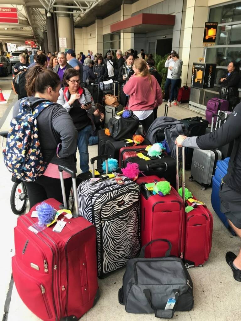 Crowds form at Louis Armstrong New Orleans International Airport after the remnants of Tropical ...