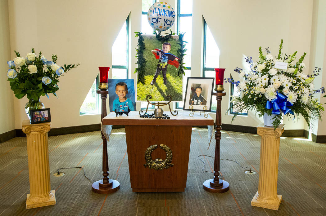 The urn and photos of Gavin Murray, 6, are presented before mourners during funeral services fo ...