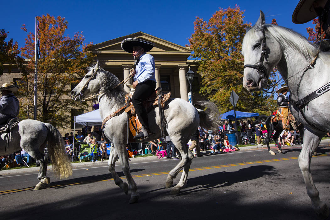 Members of Escaramuza Charra Perlas de Nevada lead their horses in a dance during the annual Ne ...