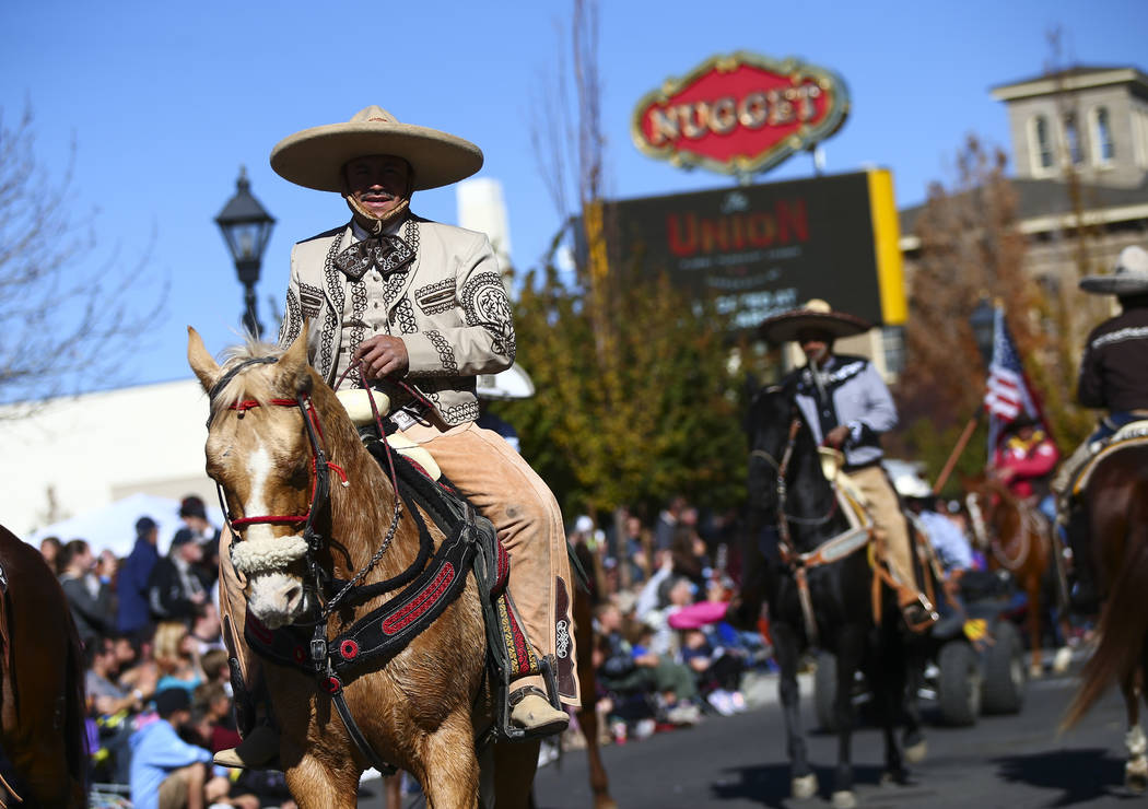 Members of Escaramuza Charra Perlas de Nevada participate in the annual Nevada Day Parade in Ca ...