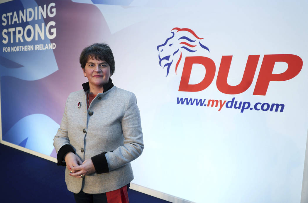 Democratic Unionist Party leader Arlene Foster poses on stage as she prepares for the the DUP a ...