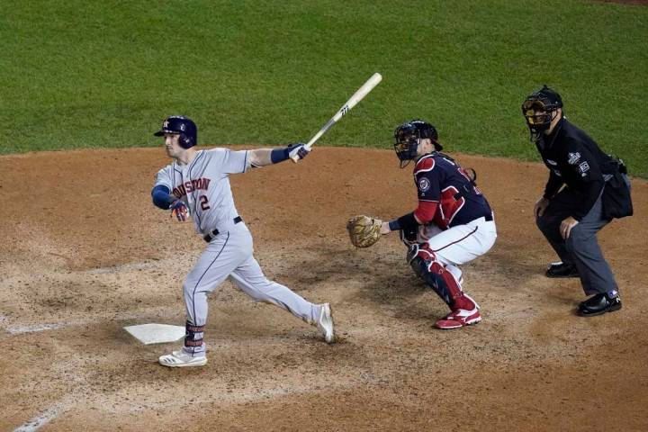 Houston Astros' Alex Bregman hits a grand slam during the seventh inning of Game 4 of the baseb ...