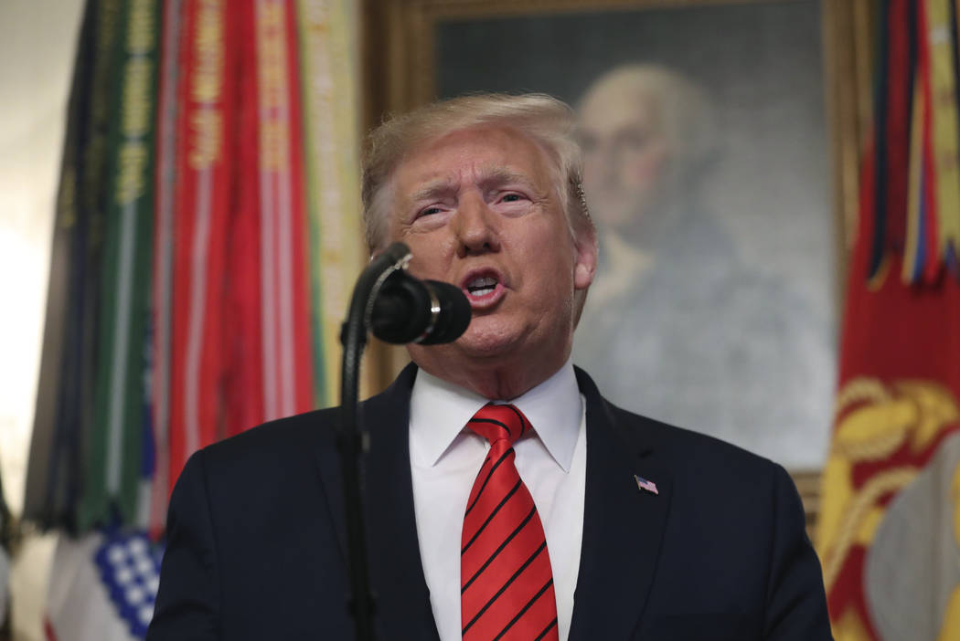 President Donald Trump speaks in the Diplomatic Room of the White House in Washington, Sunday, ...