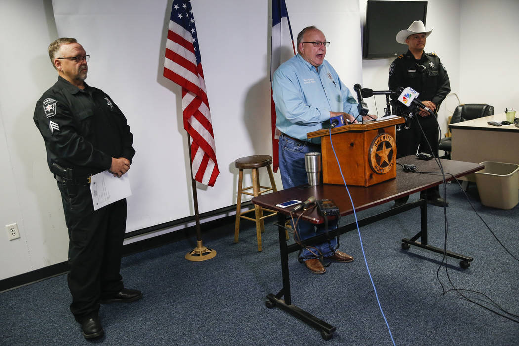 Hunt County Sheriff Randy Meeks, center, addresses members of the media at the sheriff's depart ...