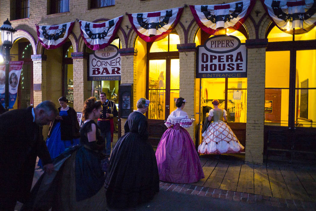 Attendees in period outfits arrive at Piper's Opera House for the Nevada Statehood Ball in Virg ...