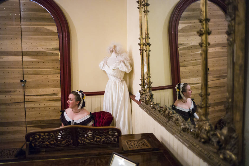 Lauren Stowell, of Reno, relaxes in the lobby of Piper's Opera House as the Nevada Statehood Ba ...