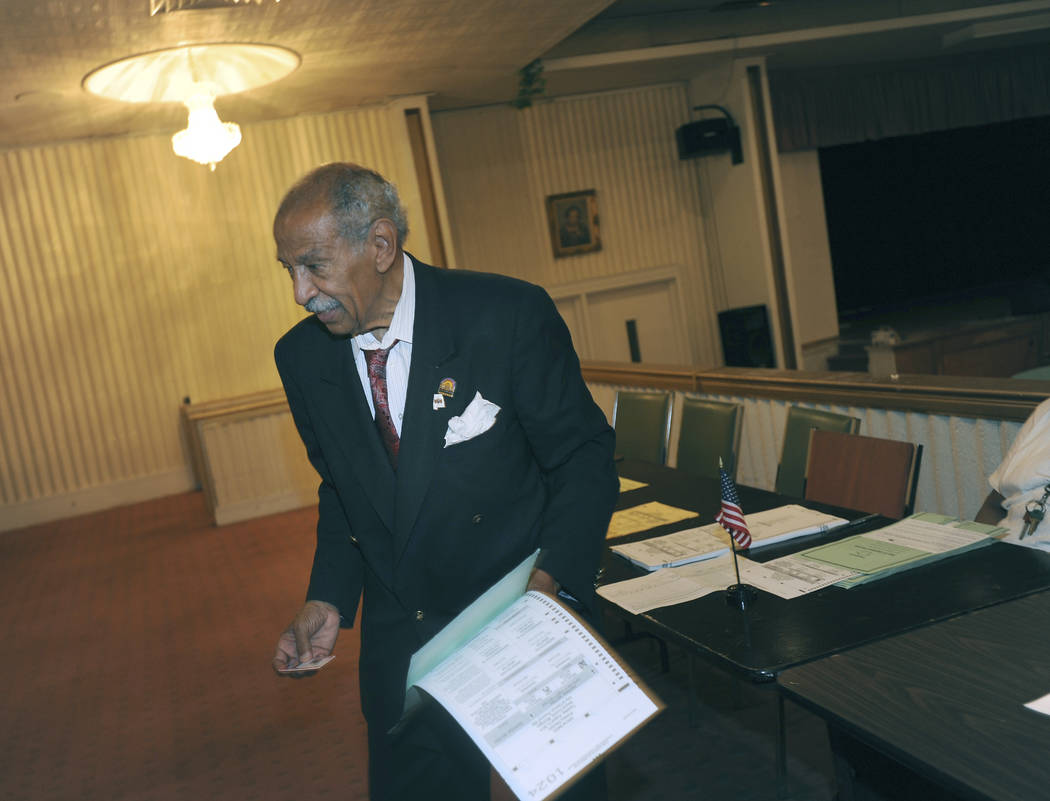 FILE - In a Tuesday, Aug. 5, 2014 file photo, Congressman John Conyers votes at Word of Power M ...