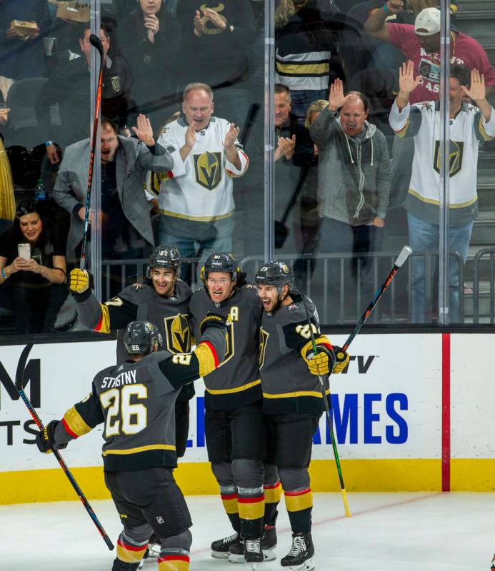 Vegas Golden Knights right wing Mark Stone (61, center) and teammates celebrate his goal over t ...