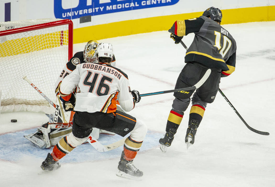 Vegas Golden Knights center Nicolas Roy (10) scores his first goal over Anaheim Ducks goaltende ...