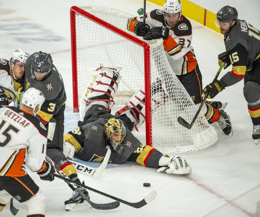 Vegas Golden Knights goaltender Marc-Andre Fleury (29) dives to recover a puck shot from the An ...