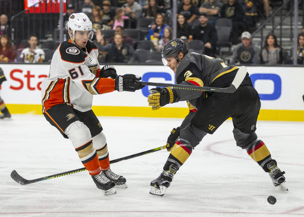 Anaheim Ducks center Troy Terry (61) has a shot deflected by Vegas Golden Knights defenseman Br ...