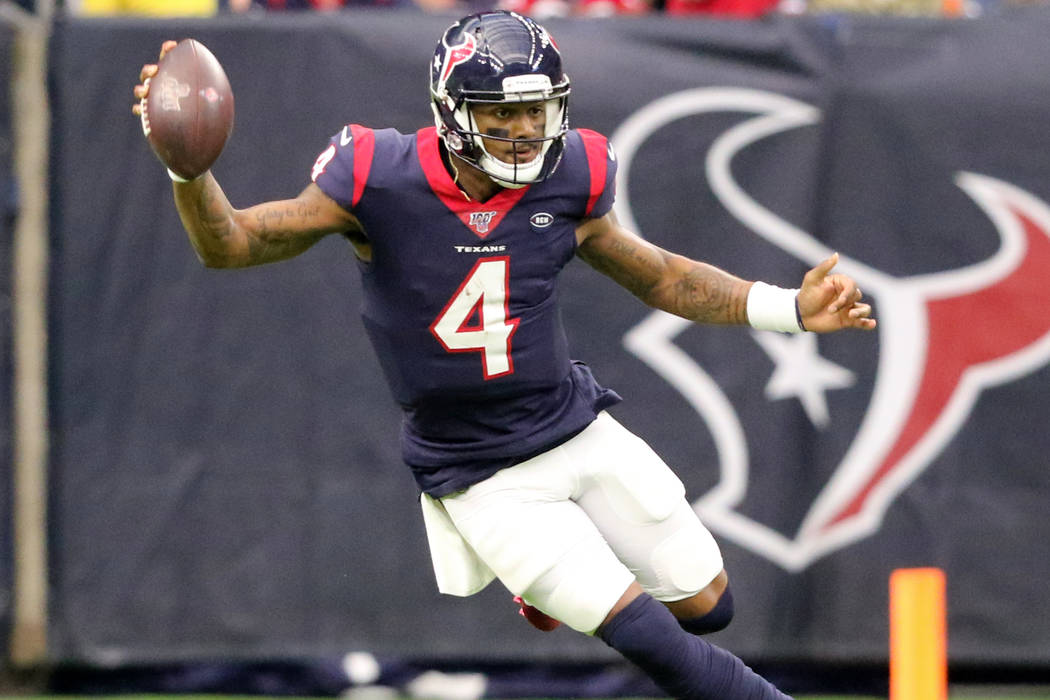 Houston Texans quarterback Deshaun Watson (4) runs with the football during the first half of a ...