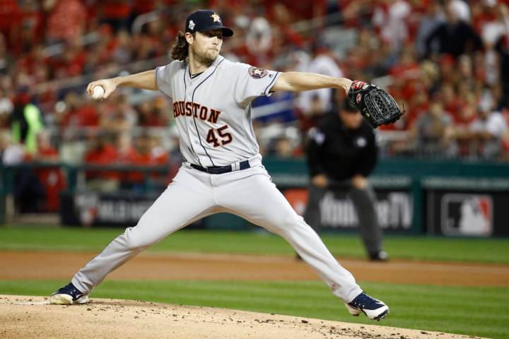 Houston Astros starting pitcher Gerrit Cole throws against the Washington Nationals during the ...