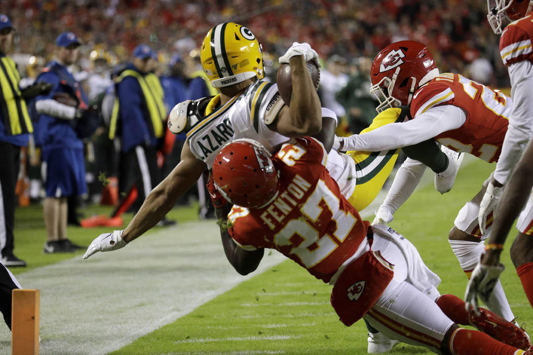Green Bay Packers wide receiver Allen Lazard (13) is tackled by Kansas City Chiefs cornerback R ...