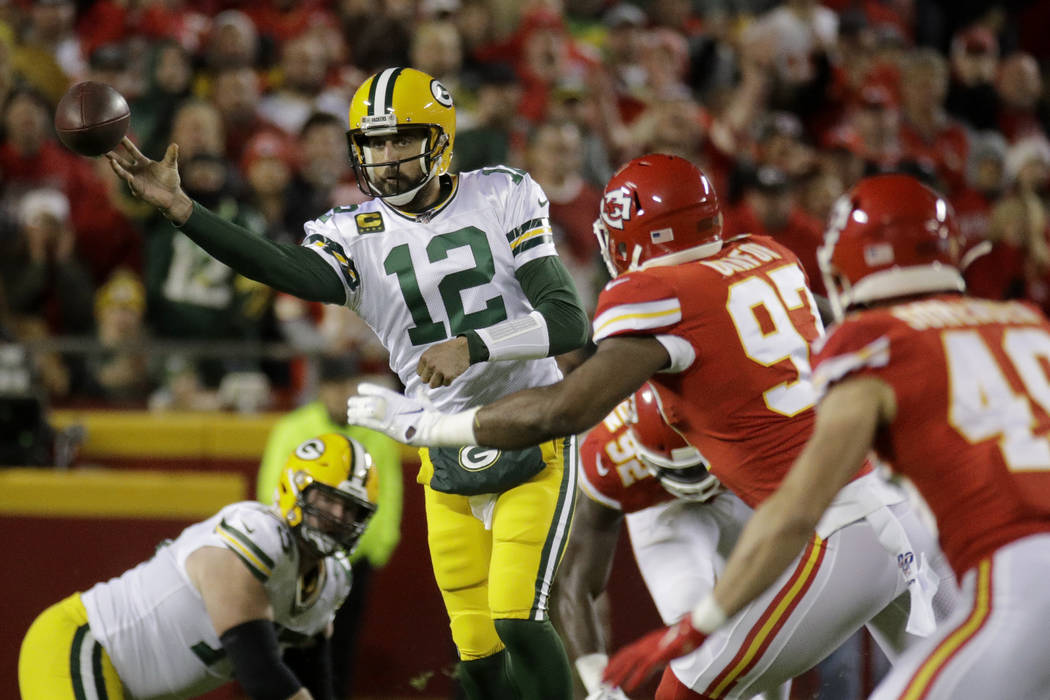 Green Bay Packers quarterback Aaron Rodgers (12) throws a pass against Kansas City Chiefs defen ...