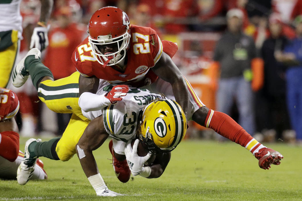 Green Bay Packers running back Aaron Jones (33) is tackled by Kansas City Chiefs cornerback Ras ...