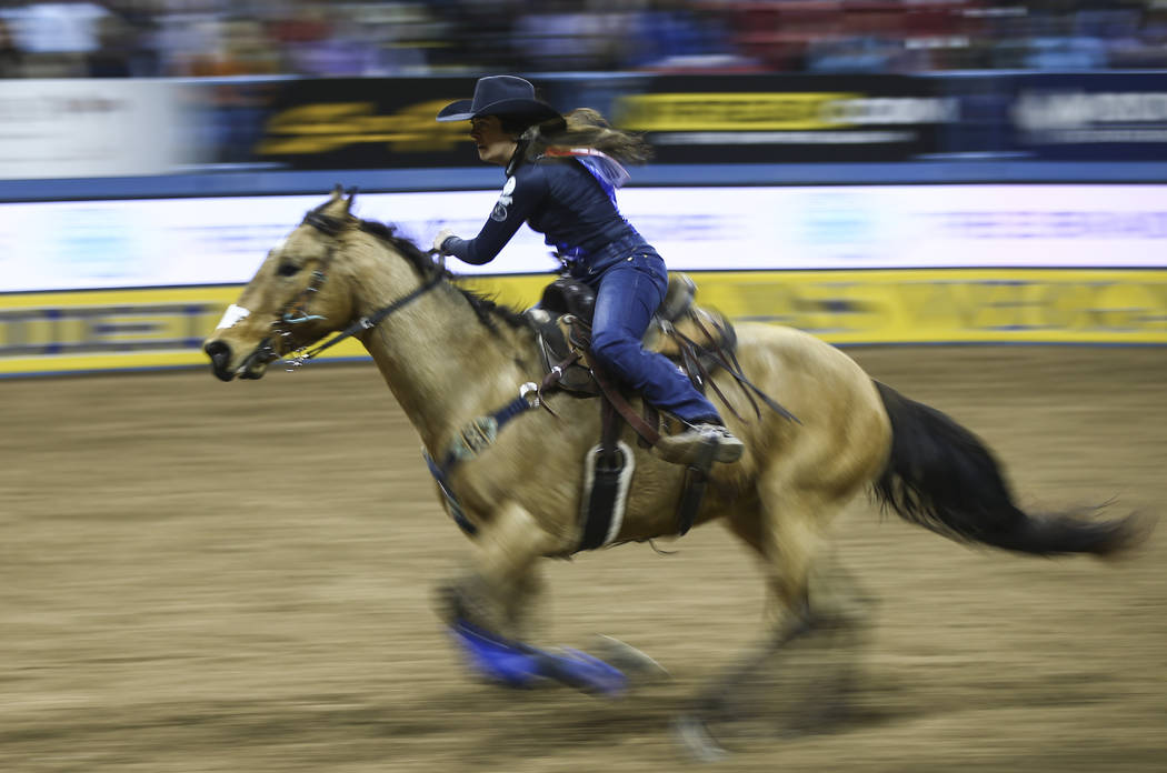 Carman Pozzobon of British Columbia, Canada competes in barrel racing during the opening night ...