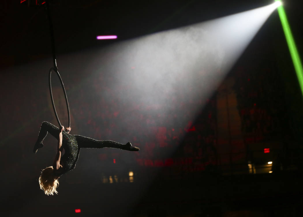 An aerialist performs during the opening night of the National Finals Rodeo at the Thomas & ...