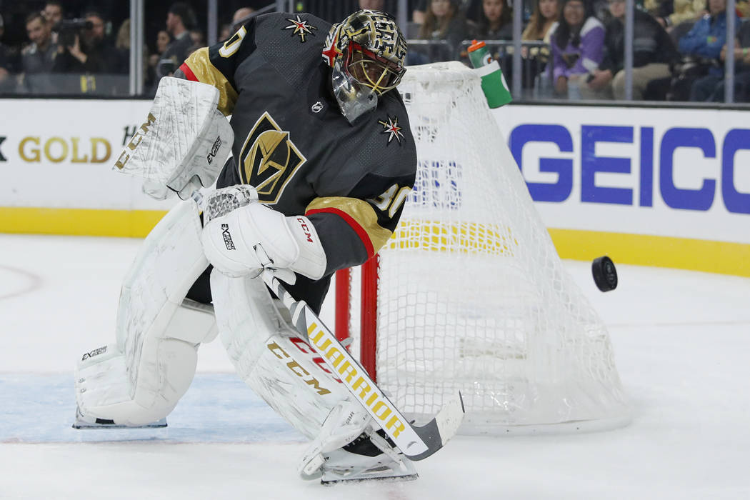 Vegas Golden Knights goaltender Malcolm Subban knocks the puck away during the first period of ...