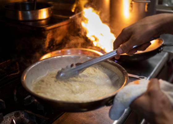 Spaghetty Western chefs dole out classic pasta dishes from the kitchen on Friday, Oct. 25, 2019 ...