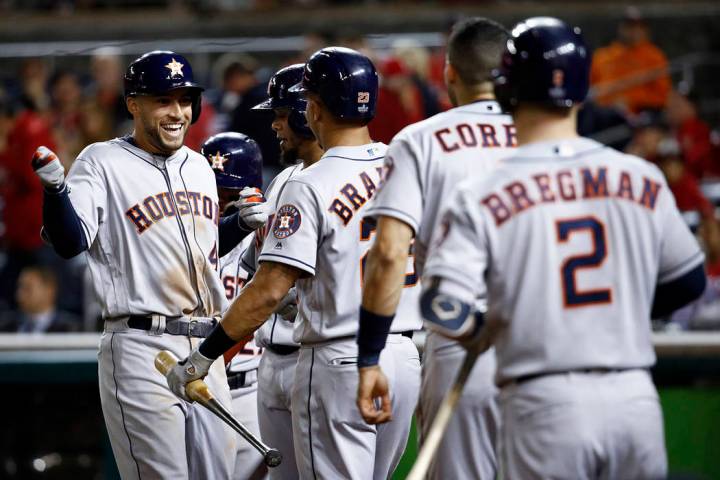 Houston Astros' George Springer celebrates after a two-run home run against the Washington Nati ...