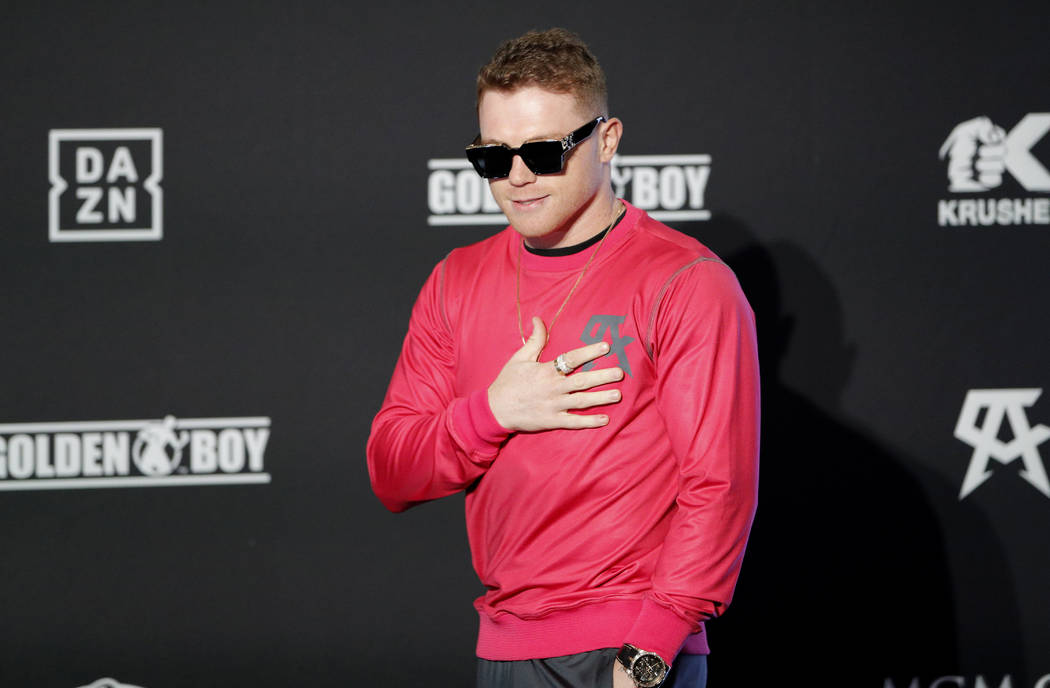 Canelo Alvarez motions to the crowd during a ceremonial arrival for an upcoming boxing match Tu ...