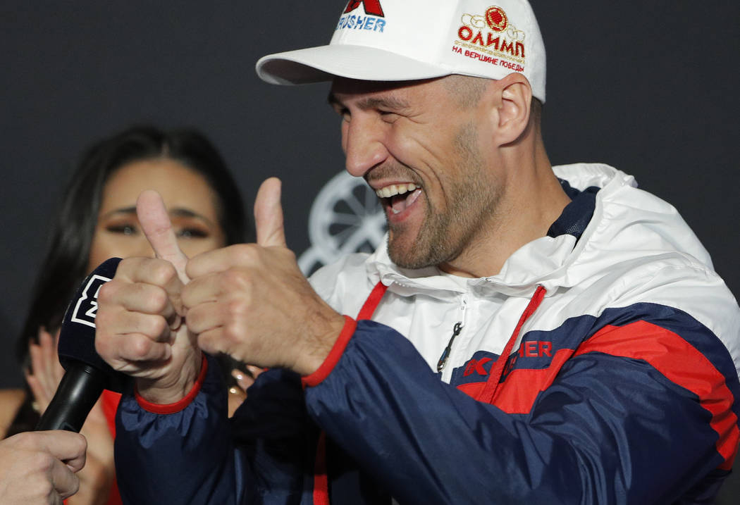 Sergey Kovalev motions to the crowd during a ceremonial arrival for an upcoming boxing match Tu ...