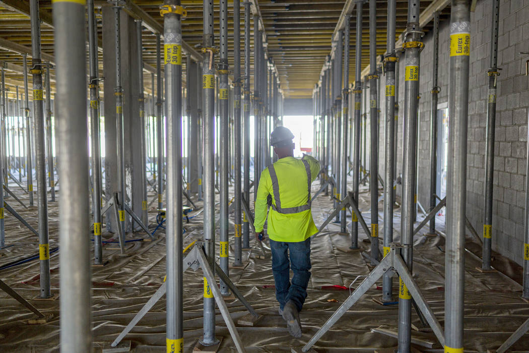 Breslin Builders superintendent Mike Vivier gives a tour of the parking garage construction tha ...