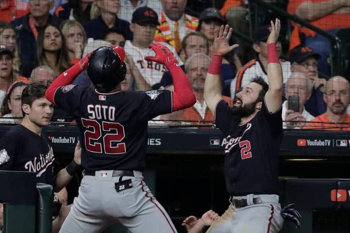 Washington Nationals' Juan Soto celebrates his home run with teammate Alex Bregman uring the fi ...