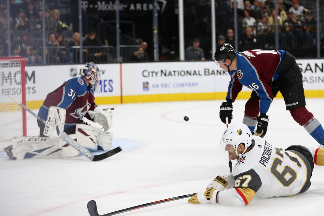 Vegas Golden Knights left wing Max Pacioretty (67) takes a fall after hitting the puck against ...